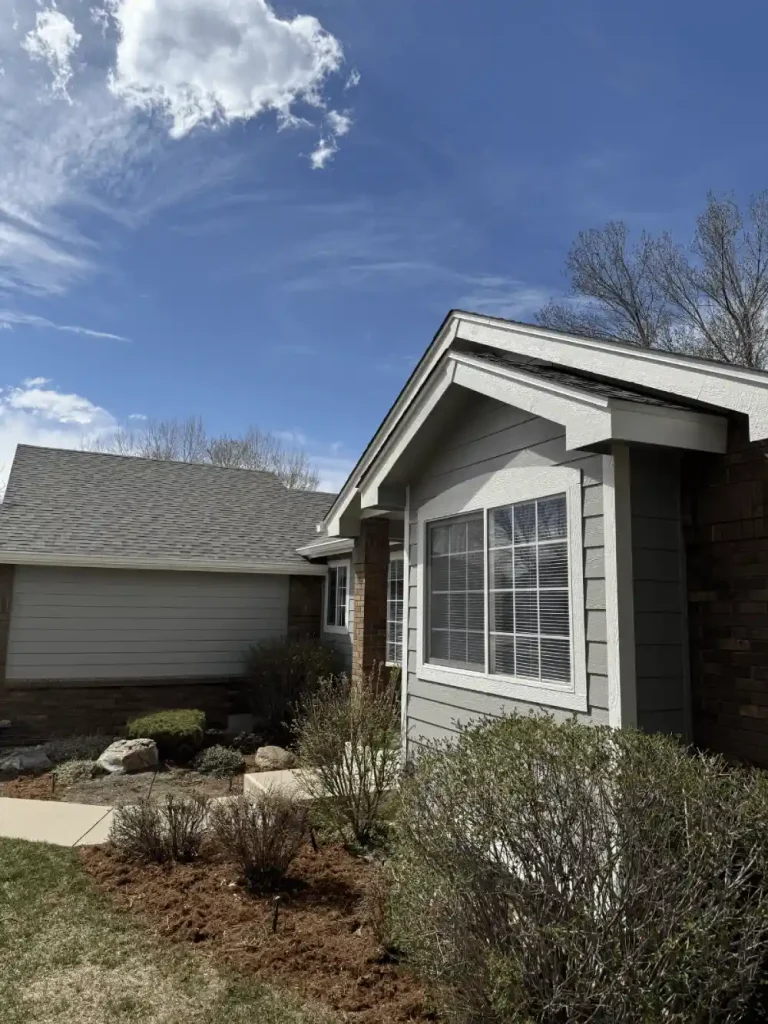 Front view of Windsor home with new roofing by EagleView Roofing, featuring durable shingles and expert craftsmanship